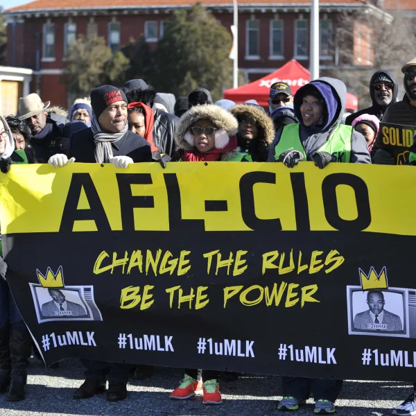 Marching with banner